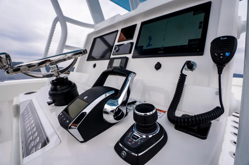 Slide: The Image of 2024 Invincible 33 Catamaran helm with advanced navigation and control systems. - 18