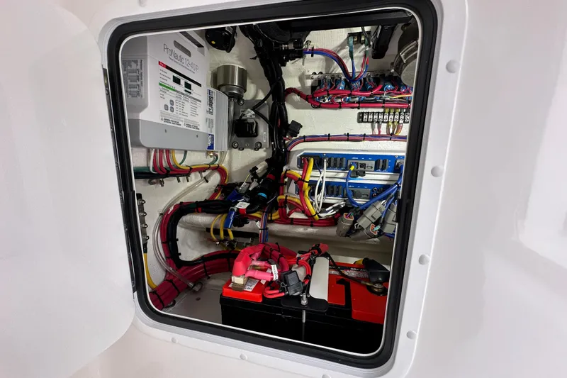 Slide: The Image of Electrical system inside 2024 Invincible 33 Catamaran, showcasing wiring and battery setup. - 35