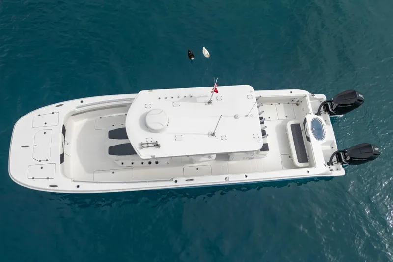 Slide: The Image of 2024 Invincible 33 Catamaran on blue water, aerial view. - 9