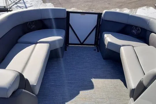 Slide: The Image of 2026 Viaggio Lago V22U boat interior with gray seating and carpeted floor. - 11