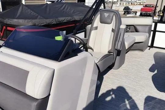 Slide: The Image of 2026 Viaggio Lago V22U boat interior with modern helm and seating. - 2