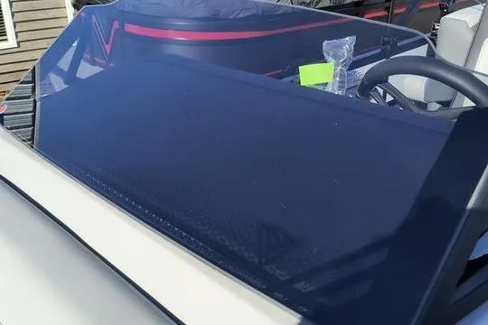 Slide: The Image of 2026 Viaggio Lago V22U boat dashboard with steering wheel and protective cover. - 3