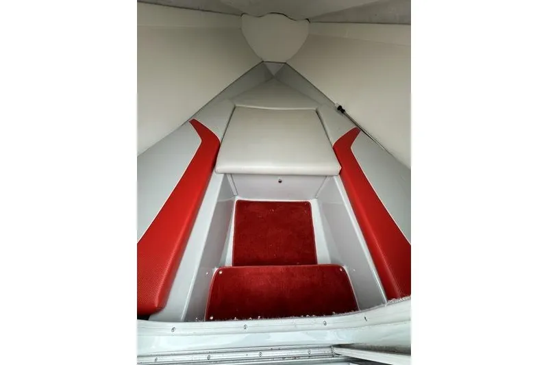 Slide: The Image of Interior of 2006 Custom 245 Boss boat with red and white seating. - 10