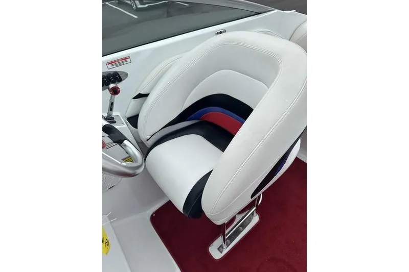 Slide: The Image of White and black boat seat with red and blue accents, Custom 245 Boss 2006 model. - 12