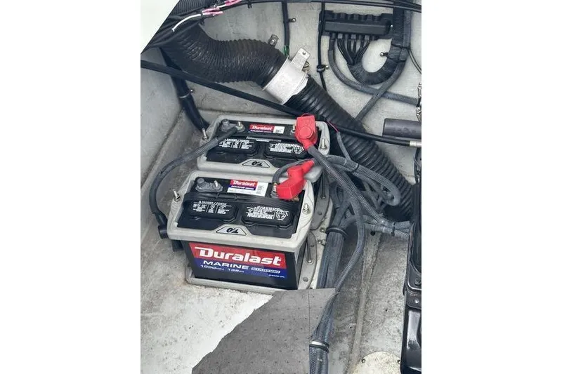 Slide: The Image of Duralast marine batteries in a 2006 Custom 245 Boss boat engine compartment. - 14