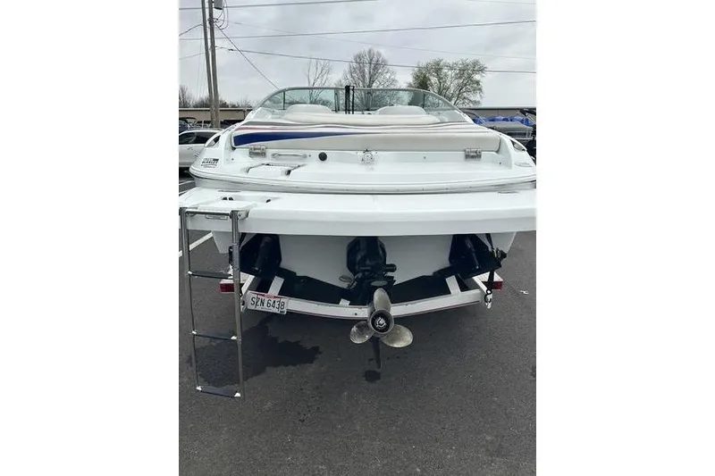 Slide: The Image of Rear view of a 2006 Custom 245 Boss boat with ladder and propeller. - 15
