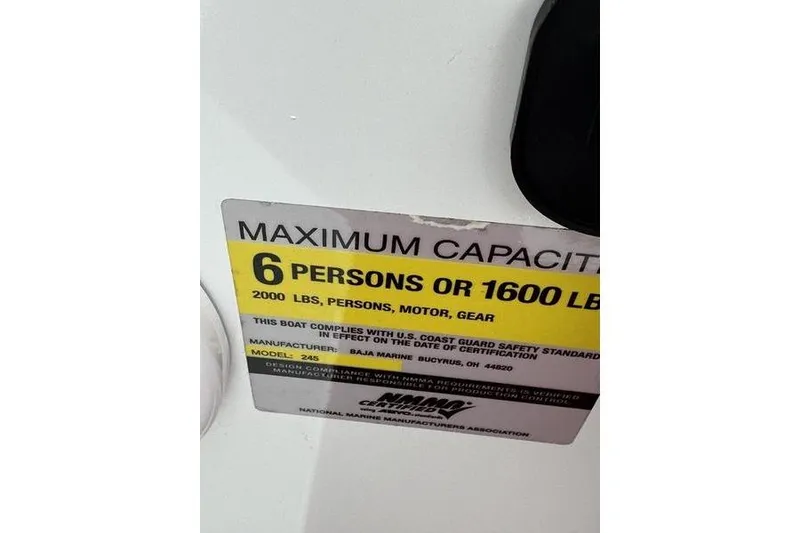 Slide: The Image of Custom 245 Boss 2006 boat capacity label: 6 persons or 1600 lbs maximum. - 17