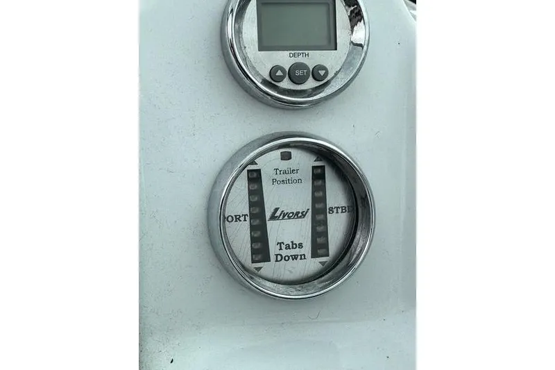 Slide: The Image of Boat dashboard with depth gauge and Livorsi trim tab indicator, Custom 245 Boss, 2006 model. - 21
