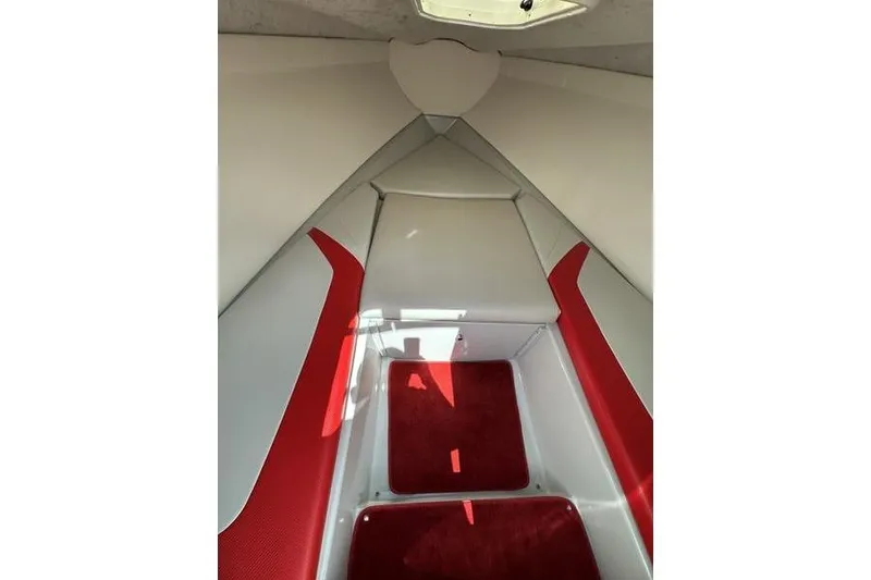 Slide: The Image of Interior of 2006 Custom 245 Boss boat with red and white seating. - 31