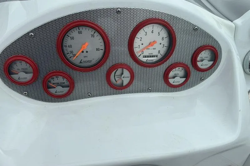 Slide: The Image of Dashboard of a 2006 Custom 245 Boss boat with Livorsi gauges. - 4