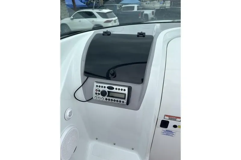 Slide: The Image of Boat dashboard with stereo system, Custom 245 Boss, 2006 model. - 5