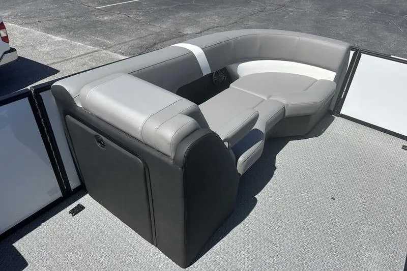 Slide: The Image of Luxurious seating on 2026 Evotti 523QL boat, featuring sleek gray and white upholstery. - 12