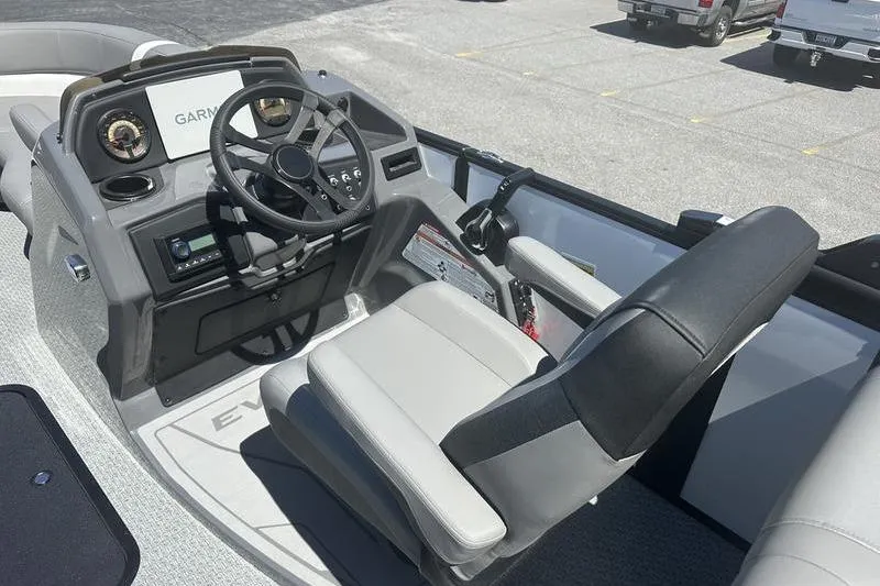 Slide: The Image of Interior of 2026 Evotti 523QL boat with steering wheel and Garmin display. - 13