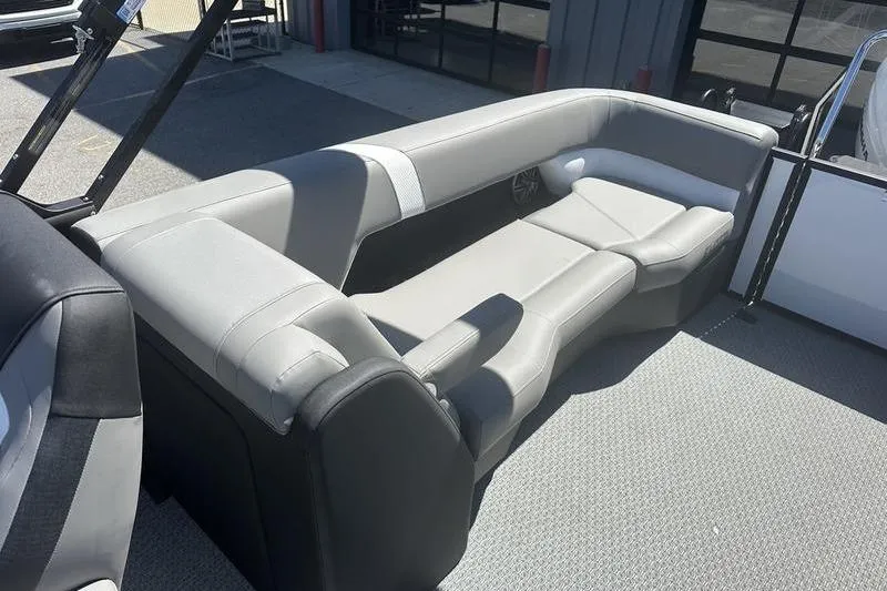 Slide: The Image of Luxurious seating area on a 2026 Evotti 523QL boat, featuring sleek gray upholstery. - 17