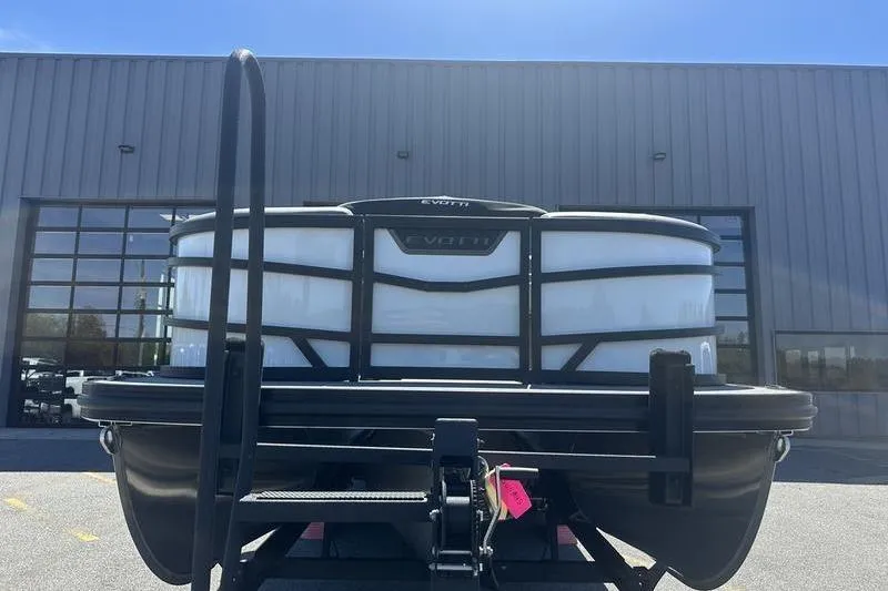 Slide: The Image of Front view of 2026 Evotti 523QL boat on trailer, industrial background. - 3