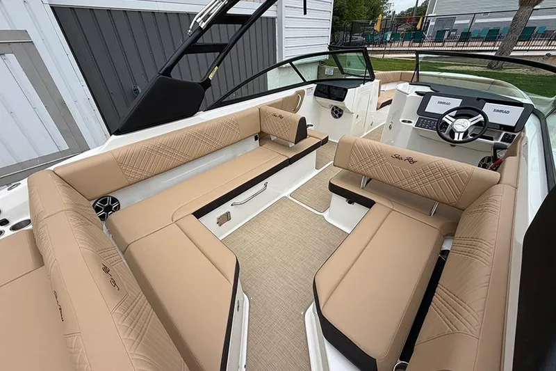 Slide: The Image of Luxurious interior of 2026 Sea Ray SDX 270 Outboard boat with tan seating. - 10