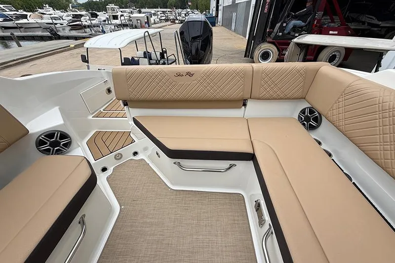 Slide: The Image of Luxurious seating on 2026 Sea Ray SDX 270 Outboard boat, docked at marina. - 13