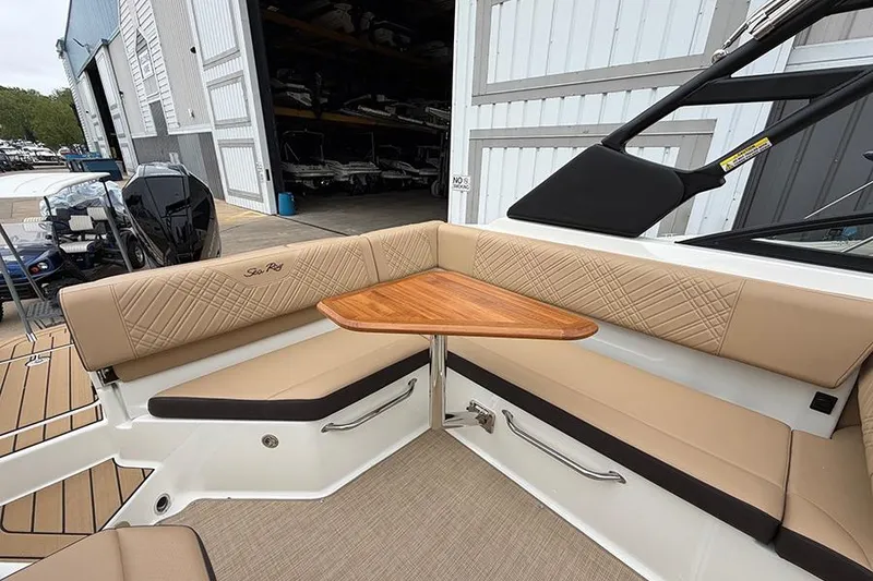 Slide: The Image of Luxurious seating area on 2026 Sea Ray SDX 270 Outboard boat with elegant wood table. - 14