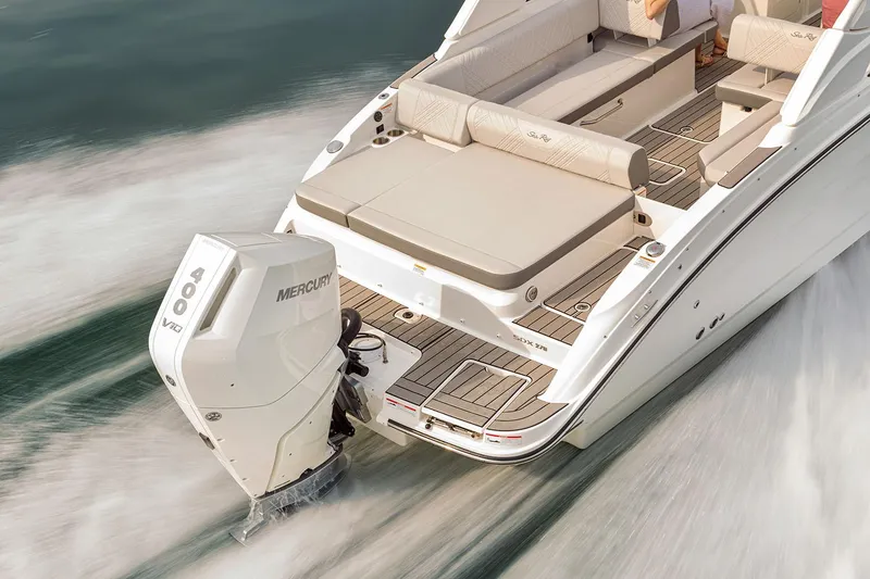 Slide: The Image of 2026 Sea Ray SDX 270 Outboard boat displayed outside a storage facility. - 2