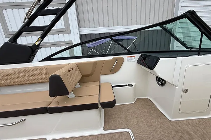 Slide: The Image of 2026 Sea Ray SDX 270 Outboard interior with tan seating and sleek design. - 26