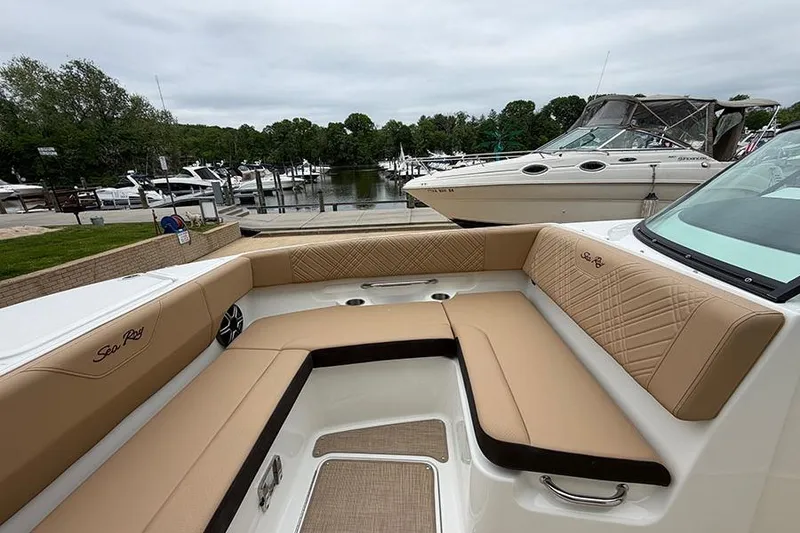 Slide: The Image of Luxurious seating on 2026 Sea Ray SDX 270 Outboard boat at marina. - 29