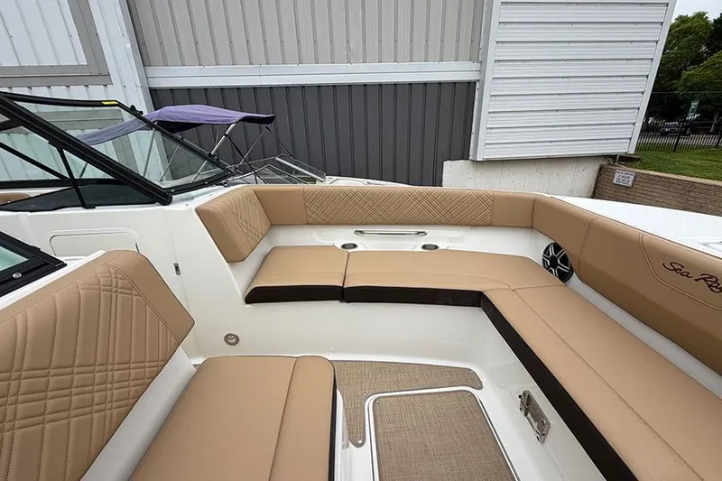 Slide: The Image of 2026 Sea Ray SDX 270 Outboard boat interior with tan seating and modern design. - 30