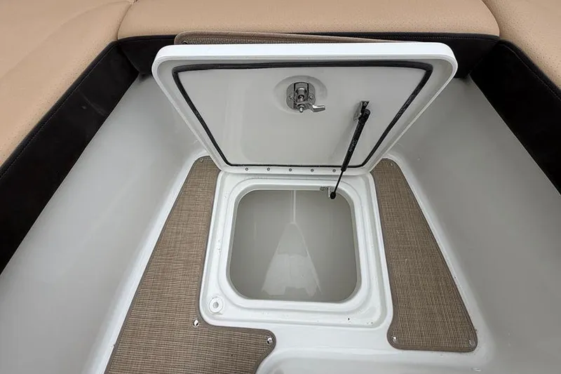 Slide: The Image of Open storage compartment on 2026 Sea Ray SDX 270 Outboard boat. - 33