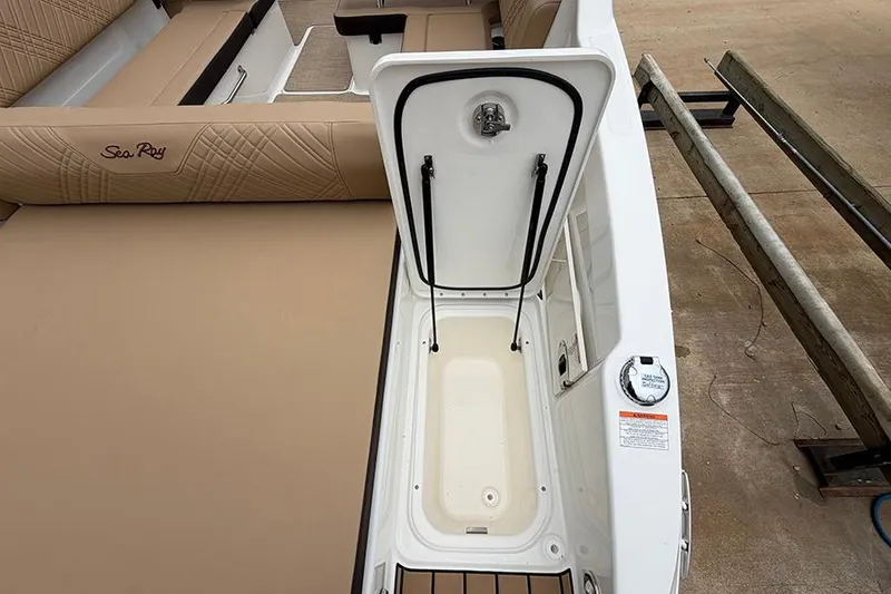 Slide: The Image of 2026 Sea Ray SDX 270 Outboard boat interior with open storage compartment. - 9