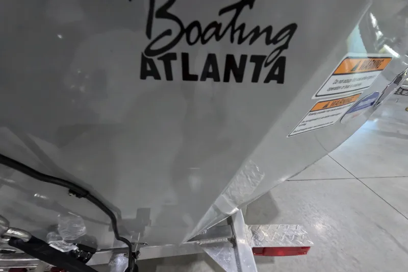 Slide: The Image of 2025 Avid 18 Rogue CC boat with "Boating Atlanta" decal and safety labels. - 10