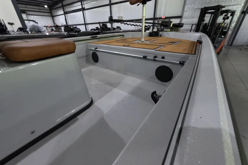 Slide: The Image of Interior view of 2025 Avid 18 Rogue CC boat, showcasing seating and deck layout. - 12