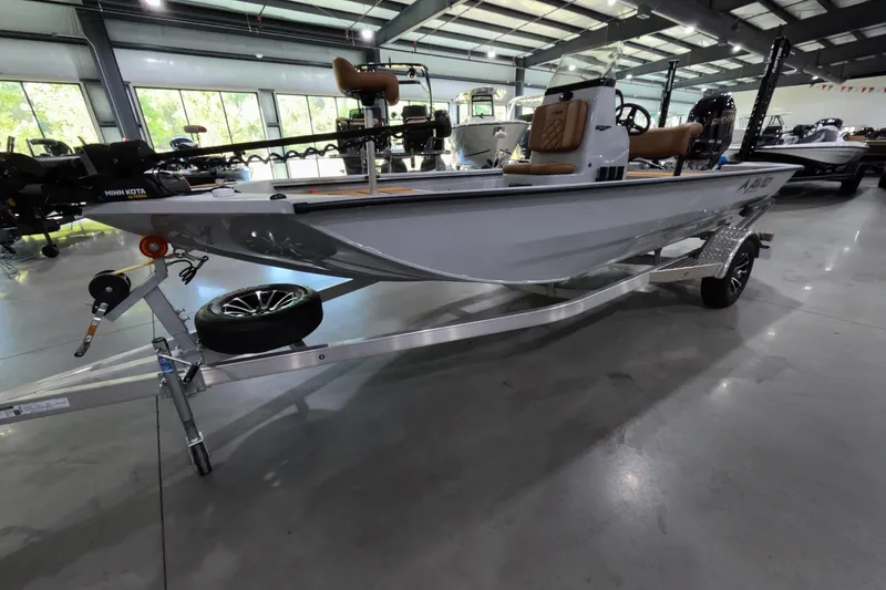 Slide: The Image of 2025 Avid 18 Rogue CC boat in showroom, featuring sleek design and modern equipment. - 3