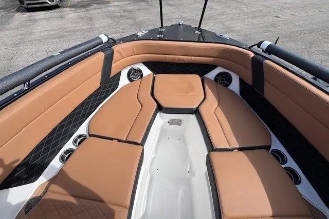 Slide: The Image of Luxurious interior of 2026 Chaparral SSX 6 boat with tan seating and black accents. - 14