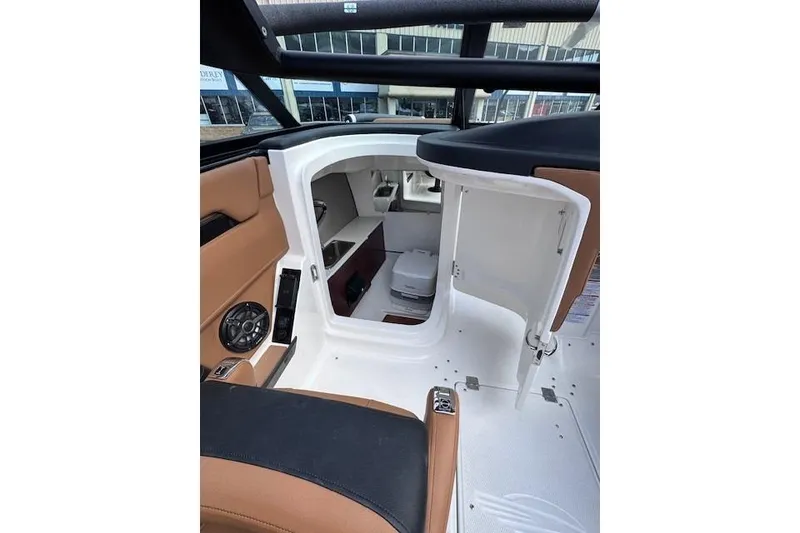 Slide: The Image of Interior cabin of 2026 Chaparral SSX 6 boat, featuring storage and seating. - 15