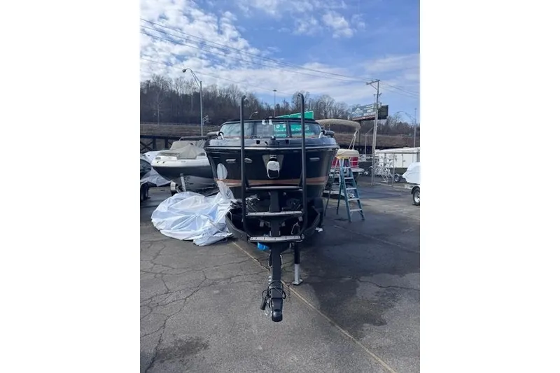 Slide: The Image of 2026 Chaparral SSX 6 boat on trailer in outdoor storage area. - 2