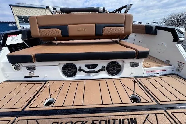 Slide: The Image of 2026 Chaparral SSX 6 boat interior with tan seating and Black Edition detailing. - 5