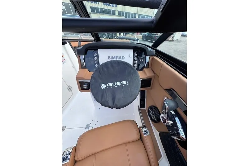 Slide: The Image of 2026 Chaparral SSX 6 boat cockpit with Simrad display and Gussi Italia steering wheel. - 8