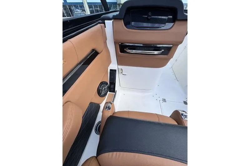 Slide: The Image of 2026 Chaparral SSX 6 interior with tan and black leather seating, sleek design. - 9