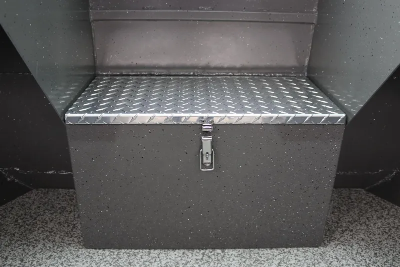 Slide: The Image of Alumaweld Intruder 22 (2026) storage compartment with diamond plate lid and latch. - 11