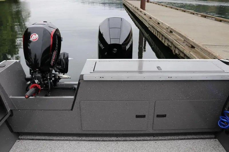 Slide: The Image of 2026 Alumaweld Intruder 22 boat with Mercury outboard engine at dockside. - 15
