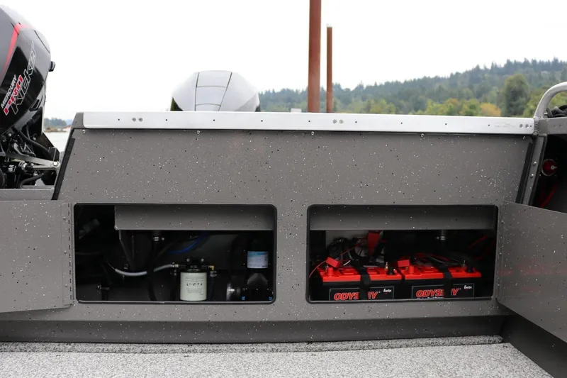 Slide: The Image of 2026 Alumaweld Intruder 22 boat showing engine compartment and battery storage. - 16