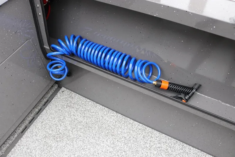 Slide: The Image of Coiled blue hose in 2026 Alumaweld Intruder 22 boat interior. - 18