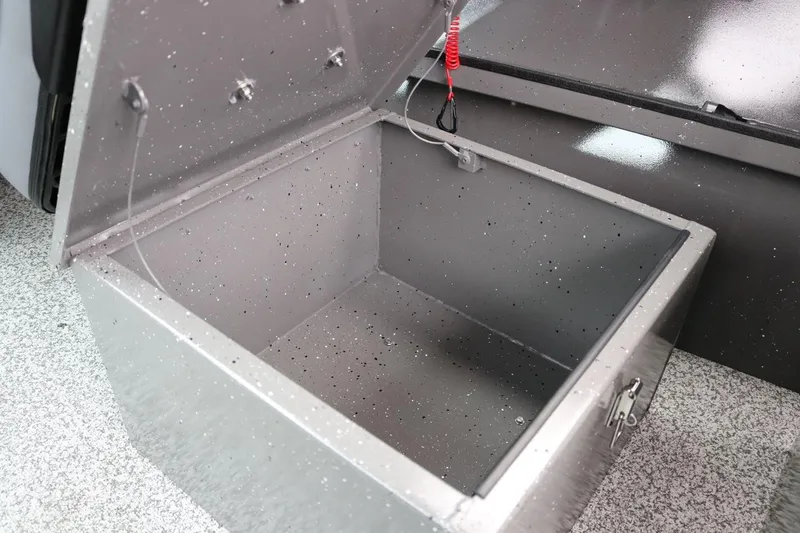 Slide: The Image of Open storage compartment in 2026 Alumaweld Intruder 22 boat, showcasing interior space. - 20