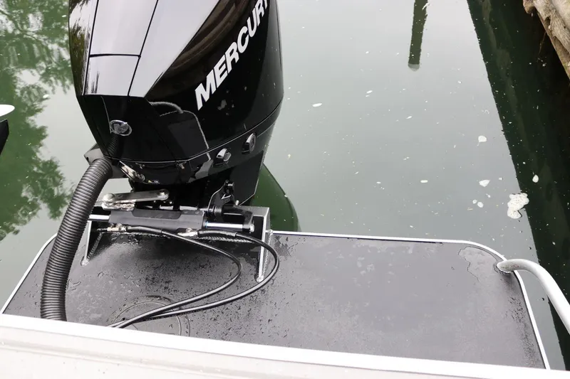 Slide: The Image of 2026 Alumaweld Intruder 22 with Mercury outboard motor on water. - 27