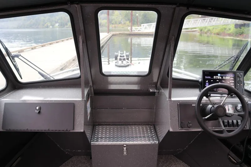 Slide: The Image of Interior view of 2026 Alumaweld Intruder 22 boat cockpit with steering wheel and dashboard. - 3