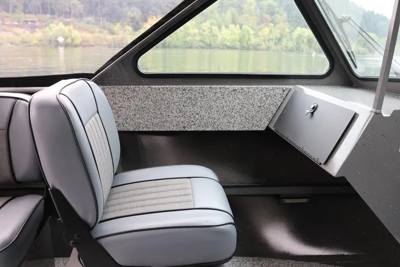 Slide: The Image of Interior of 2026 Alumaweld Intruder 22 boat with gray seating and dashboard. - 6