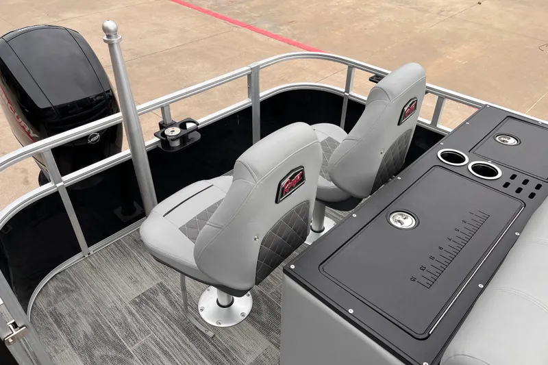 Slide: The Image of 2024 Ranger Reata 220FC boat interior with gray seating and fishing station. - 11
