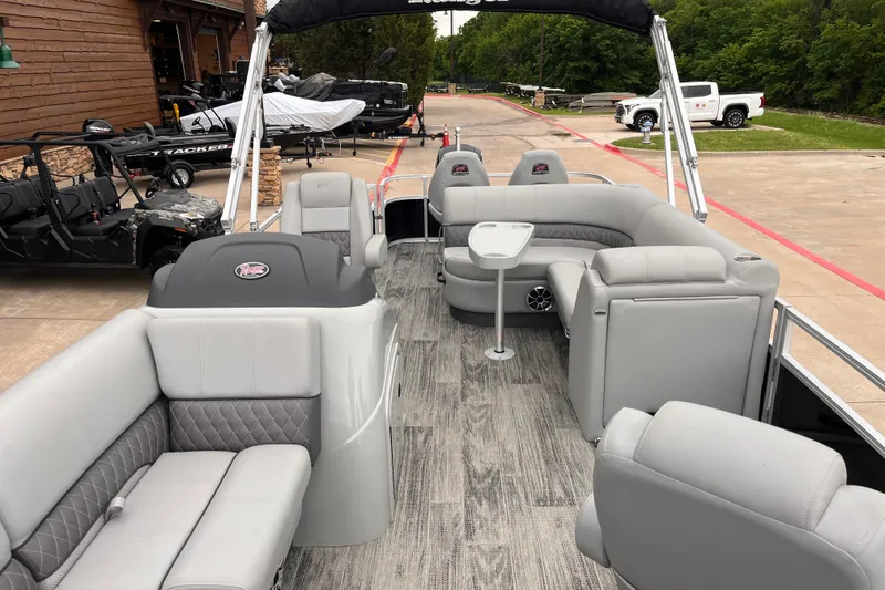 Slide: The Image of 2024 Ranger Reata 220FC pontoon boat with luxurious gray seating and modern design. - 3