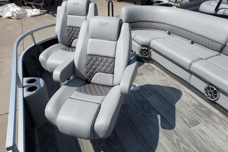 Slide: The Image of 2024 Ranger Reata 220FC boat interior with luxurious gray seating and cup holders. - 5