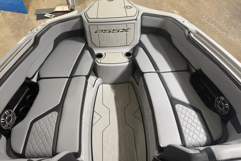 Slide: The Image of 2026 Yamaha Boats 255XD interior with sleek gray seating and modern design. - 10