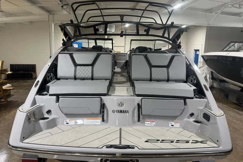 Slide: The Image of 2026 Yamaha Boats 255XD interior view, showcasing sleek seating and modern design. - 2